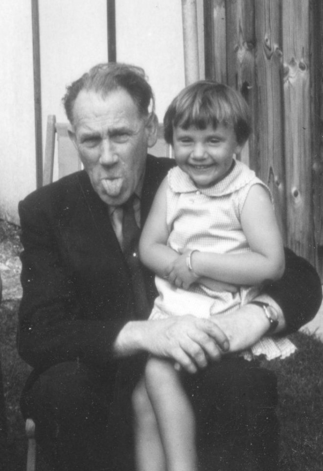 A rare photo of the Leslie side of the family. My dad holding my brother; me sitting on my great uncle Tom's knee. 